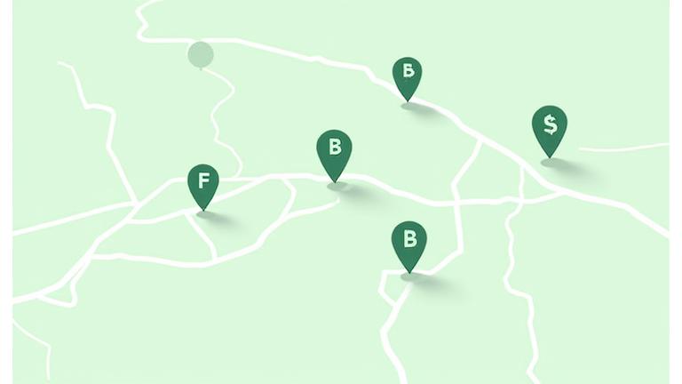 An illustrated map of Franklin, Tennessee, highlighting areas with green business pins and nature-themed icons.